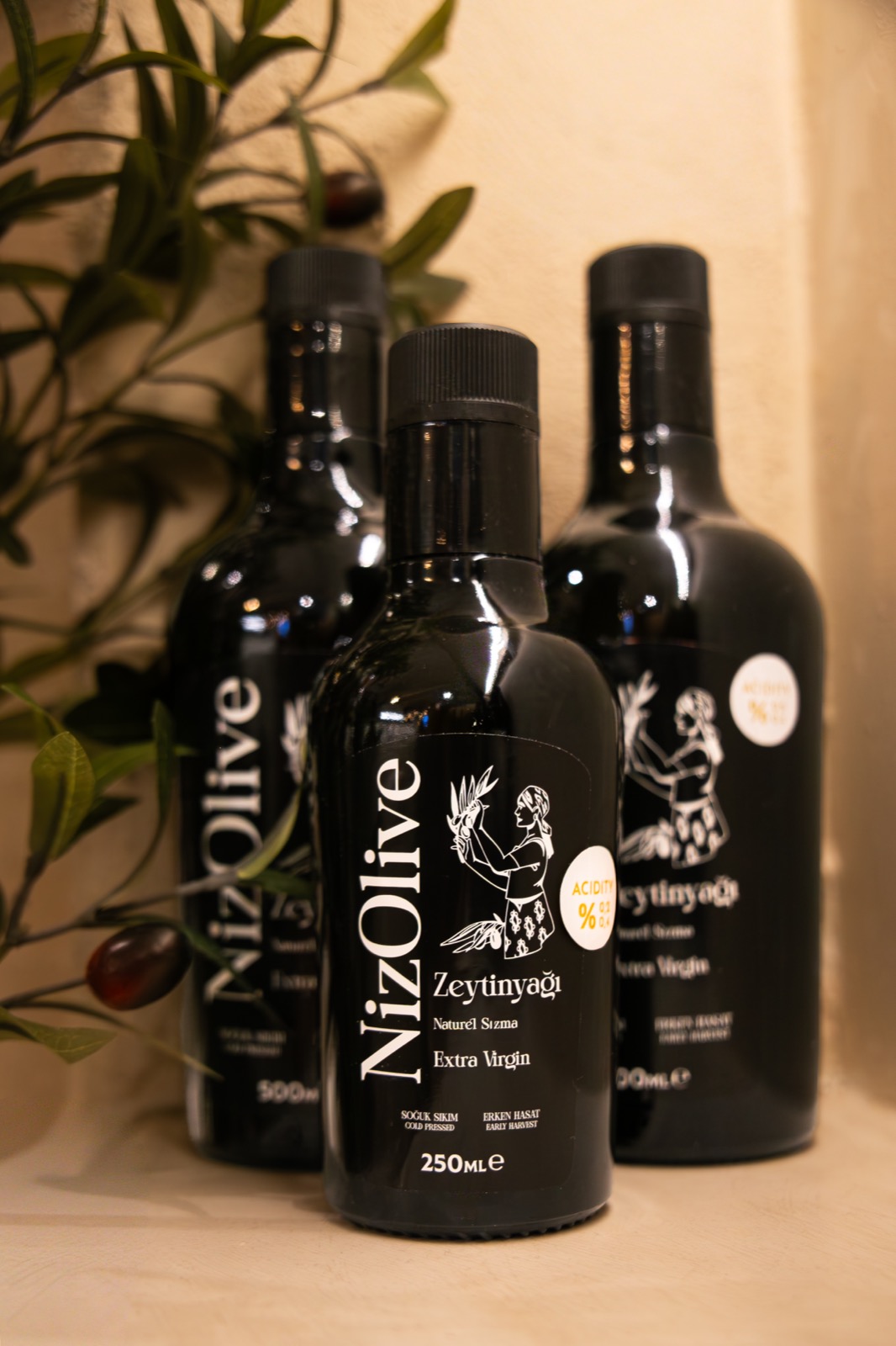 NizOlive bottle on a book, The Golden Mark of the Aegean