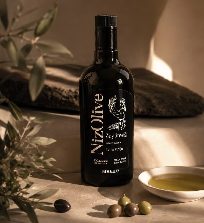 NizOlive bottle styled with olive branch and stone